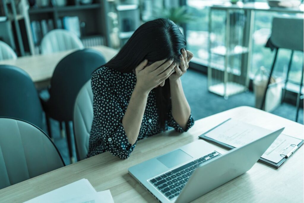 frustrated business owner in front of computer